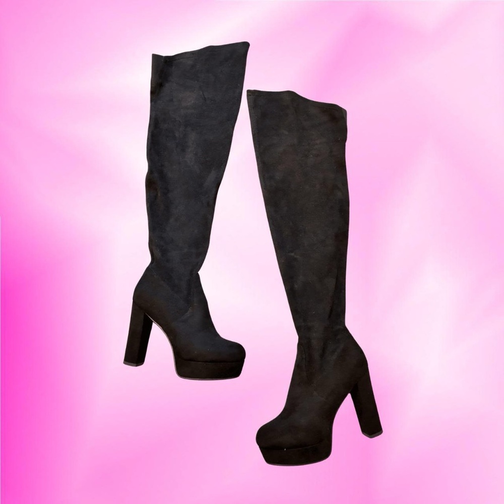 Black suede thigh-high boots with a high heel.